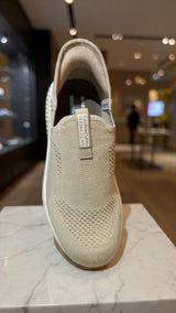 Beige slip-on knit walking shoe with breathable upper and cushioned sole