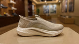 Light beige comfort slip-on shoe featuring soft fabric and flexible outsole