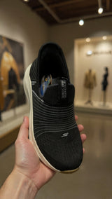 Black knit slip-on sneaker with extra thick comfort sole
