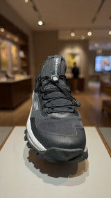 Men’s black outdoor running sneaker featuring breathable mesh upper and durable grip sole