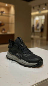 Men’s black outdoor running sneaker featuring breathable mesh upper and durable grip sole