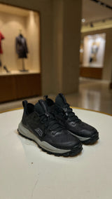 Men’s black outdoor running sneaker featuring breathable mesh upper and durable grip sole