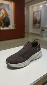 Casual brown slip-on walking shoe with soft fabric upper and shock-absorbing outsole