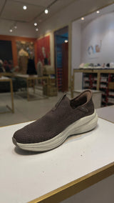 Casual brown slip-on walking shoe with soft fabric upper and shock-absorbing outsole