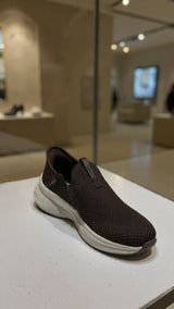 Casual brown slip-on walking shoe with soft fabric upper and shock-absorbing outsole