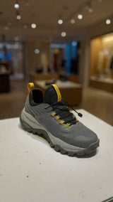 Modern grey athletic sneaker designed for outdoor trails with durable grip
