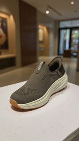 Lightweight slip-on walking shoe with breathable fabric and thick comfort outsole
