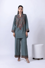 Traditional Pakistani embroidered kurta with wide leg trousers