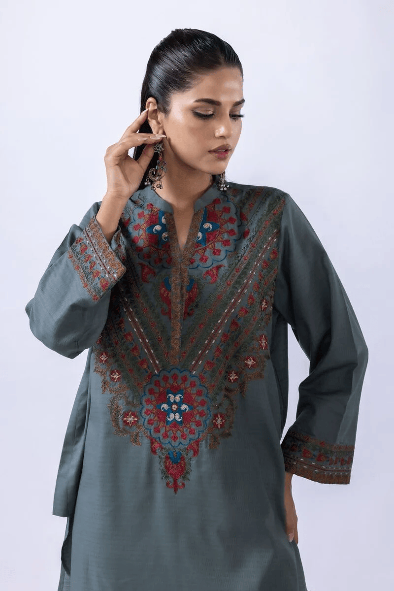 Woman wearing grey green embroidered kurta with matching palazzo trousers, Pakistani women traditional outfit