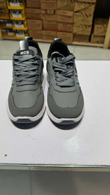 Pair of kids sneakers in black/white, grey and olive green