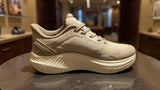 Light beige athletic sneaker with thick sole and breathable mesh design