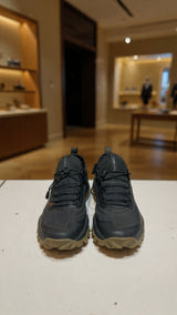 Pair of black outdoor sports shoes featuring rugged sole