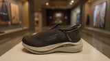 Casual brown slip-on walking shoe with soft fabric upper and shock-absorbing outsole