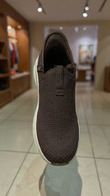 Casual brown slip-on walking shoe with soft fabric upper and shock-absorbing outsole