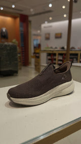 Casual brown slip-on walking shoe with soft fabric upper and shock-absorbing outsole