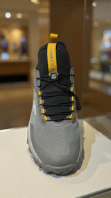 Modern grey athletic sneaker designed for outdoor trails with durable grip