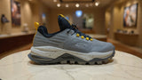 Modern grey athletic sneaker designed for outdoor trails with durable grip