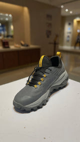 Modern grey athletic sneaker designed for outdoor trails with durable grip