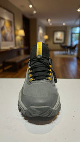 Modern grey athletic sneaker designed for outdoor trails with durable grip