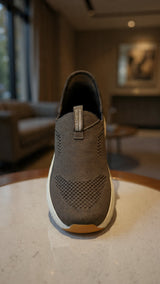 Lightweight slip-on walking shoe with breathable fabric and thick comfort outsole